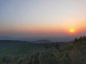 Scenic view of landscape against sky during sunset