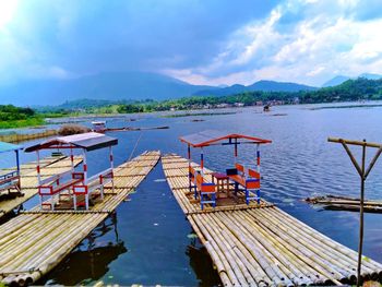 Pier over lake against sky