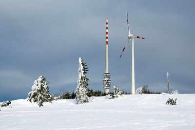 Low angle view of snow on mountain against sky