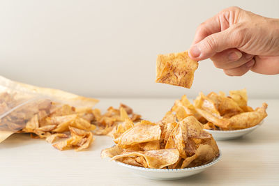 Close-up of hand holding food