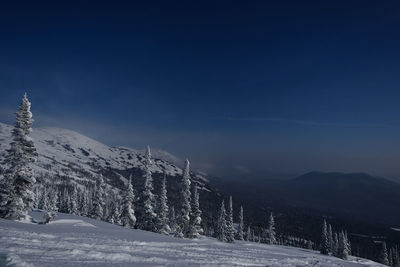 Sunny winter morning in the mountains of sheregesh on the ski track