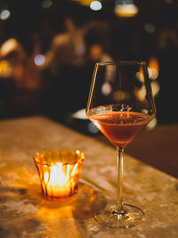 Close-up of wineglass on table