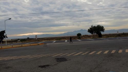 Road against cloudy sky