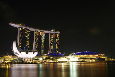 Illuminated city at waterfront