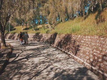 Woman walking on footpath