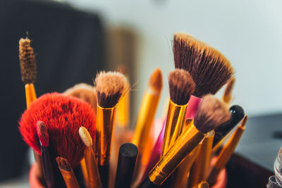 Close-up of make-up brushes on table