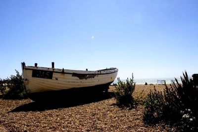 Scenic view of sea against clear blue sky