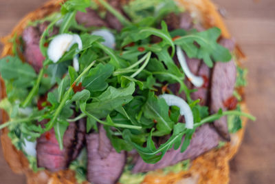 High angle view of vegetables in basket on table