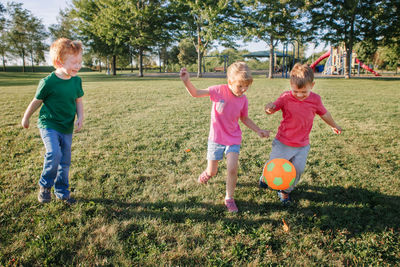 Children playing with ball at park