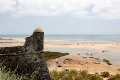 View of calm beach against the sky