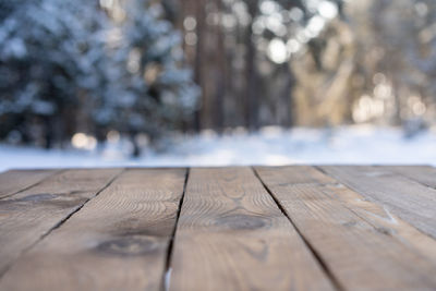 Close-up of wooden bench on table