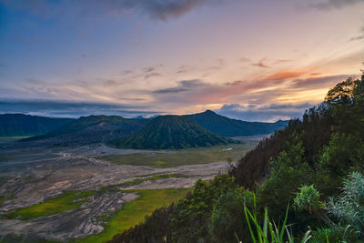 Scenic view of landscape against sky during sunset