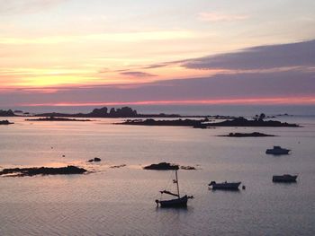 High angle view of boats in calm sea at sunset