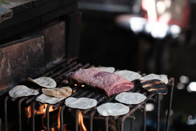 Close-up of meat on barbecue grill