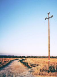 Scenic view of agricultural field against clear blue sky