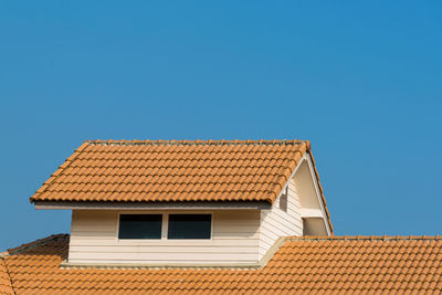 Low angle view of building against clear blue sky