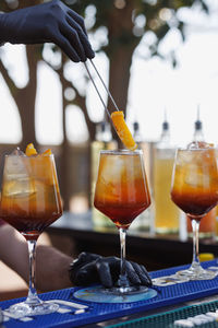 Cropped hand holding wineglass