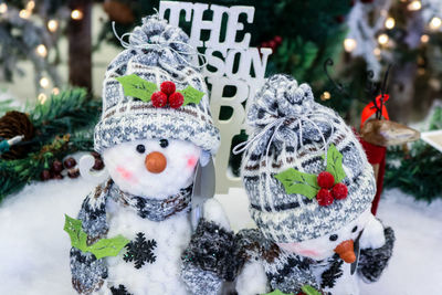 Close-up of christmas decorations in snow