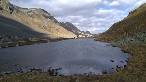 Scenic view of lake and mountains against sky