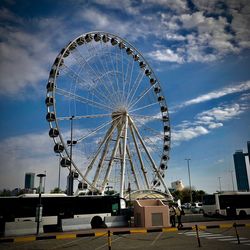 Low angle view of ferris wheel against sky