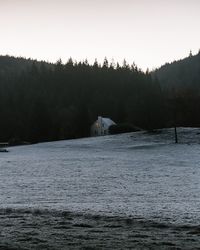 Scenic view of lake against sky during winter