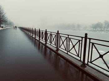 Pier over lake during winter