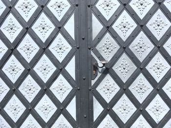 Full frame shot of hand on tiled floor