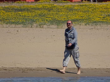 Full length portrait of man standing outdoors