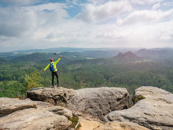 Rear view of man standing on mountain