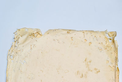 Close-up of bread against white background