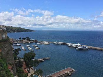 Boats in sea against sky