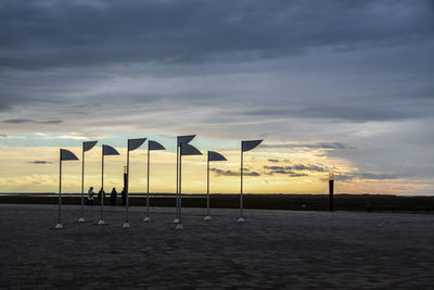 Lifeguard hut at beach against sky