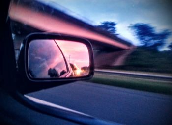 Reflection of car on side-view mirror