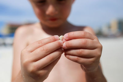 Close-up of man holding hands