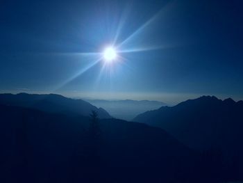 Scenic view of silhouette mountains against sky