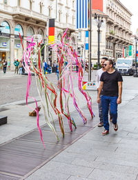 Full length portrait of man standing in city