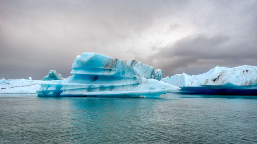 Scenic view of sea against sky during winter