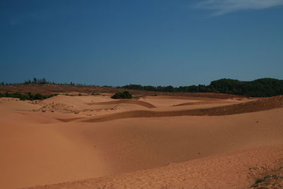 Scenic view of desert against clear sky