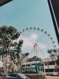 Ferris wheel against sky in city