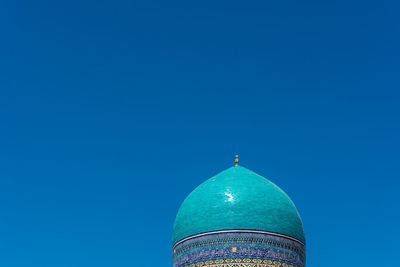 Low angle view of a building against blue sky