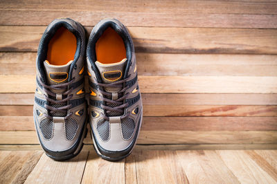 Close-up of hiking boots on wooden table
