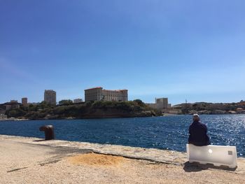 Rear view of man looking at sea