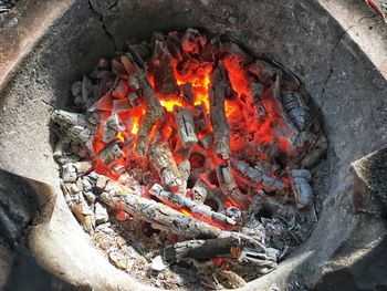 High angle view of fire on wood