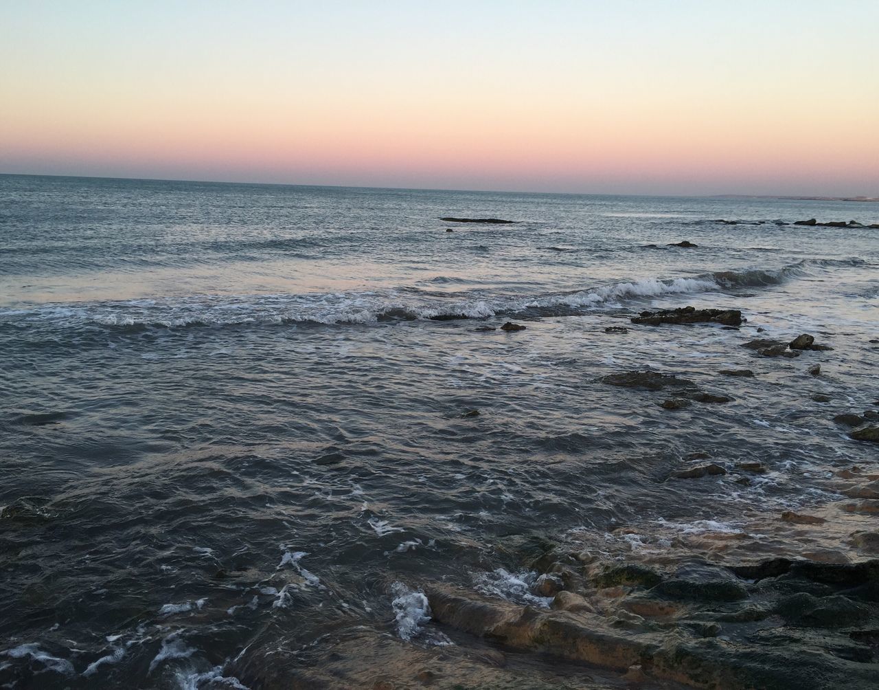 sea, horizon over water, water, scenics, tranquil scene, sunset, beauty in nature, tranquility, clear sky, beach, idyllic, wave, nature, copy space, shore, seascape, sky, orange color, rippled, remote