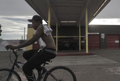 Side view of man riding bicycle