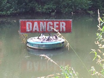 Boats moored in river