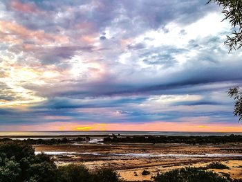 Scenic view of sea against cloudy sky