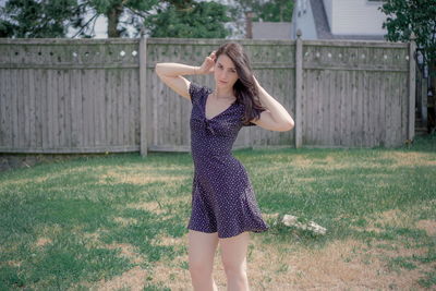 Full length of woman standing on field