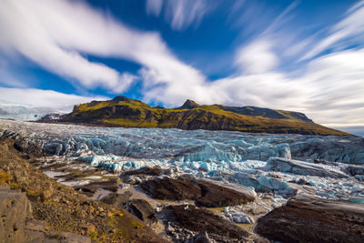 Scenic view of snowcapped mountains against sky