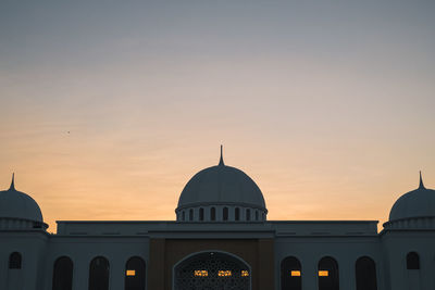 Building against sky during sunset